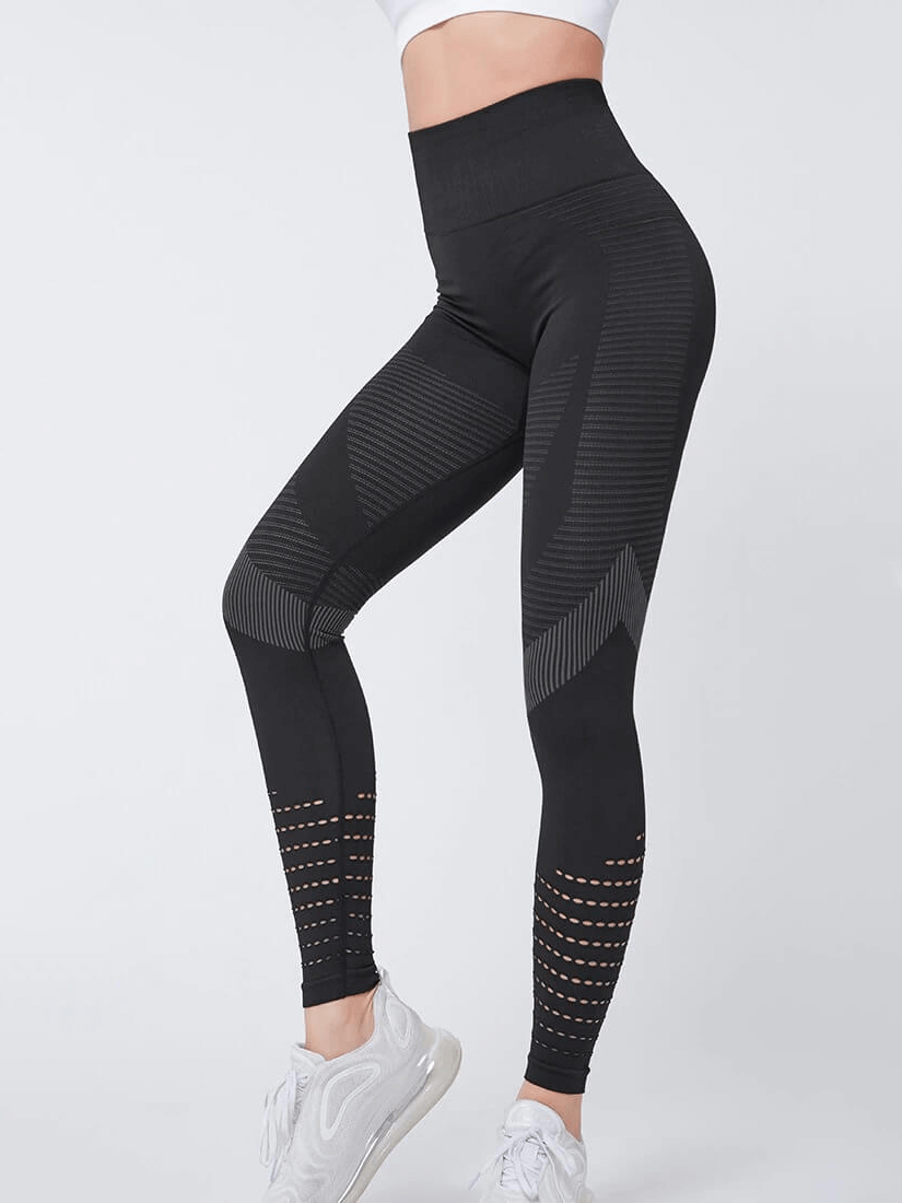 Women's black hollow seamless high-waisted leggings, tailored fit, booty-lifting style, breathable fabric, perfect for fitness.